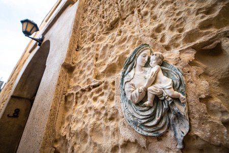 Photo for Religious Virgin Mary figure on a house wall in Malta Island. - Royalty Free Image