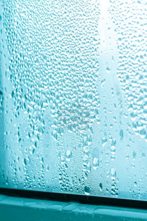 Photo for Large drops of condensate on a metal-plastic window. Greenhouse effect. Ecology - Royalty Free Image