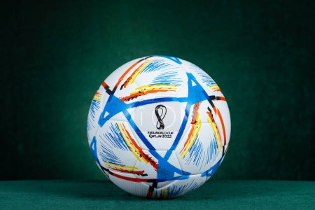 Photo for ZHONGSHAN China-November 19,2022:a football or soccer for The FIFA World Cup - Qatar 2022 on green background at horizontal composition. - Royalty Free Image
