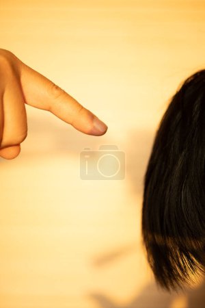 Photo for Adult pointing and blaming a child - Royalty Free Image