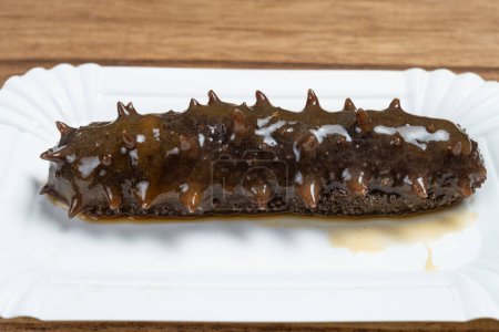angle view sea cucumber on a plate at horizontal composition