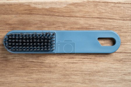 top view cleaning brush on wood background