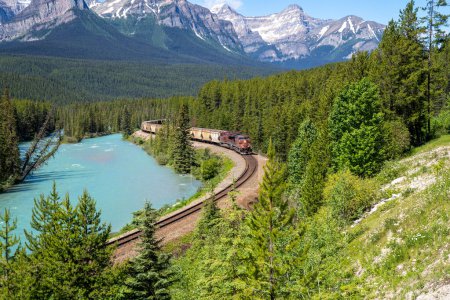 Photo for Freight train going through Morants Curve on a sunny summer day in Banff National Park Canada - Royalty Free Image