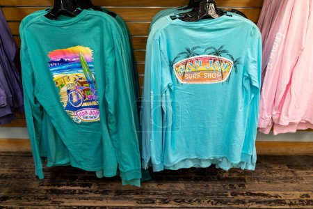 Photo for Cocoa Beach, Florida - December 29, 2022: Shirts and clothing for sale inside the Ron Jon surf shop, the largest surfing goods store in the world - Royalty Free Image