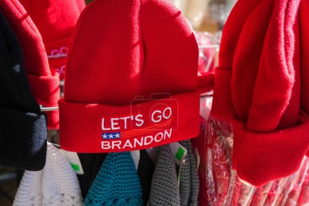 Téléchargez les photos : St. Augustine, Florida - December 28, 2022: Lets Go Brandon red winter beanie hat for sale at a gift shop, popular phrase for MAGA Donald Trump republican supporters - en image libre de droit