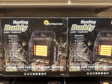 Photo for Brooklyn Park, Minnesota - July 30, 2023: Hunting Buddy Mr. Heater brand indoor safe portable radiant heaters on sale at a Fleet Farm store - Royalty Free Image