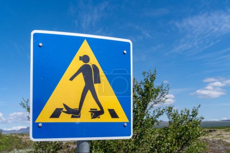 Photo for Funny scuba diver pedestrian crossing at Silfra, in Thingvellir National Park Iceland - Royalty Free Image
