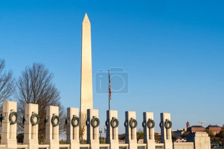 Photo for Washington, DC - November 11, 2023: World War II Memorial and the Washington Monument at sunset - Royalty Free Image