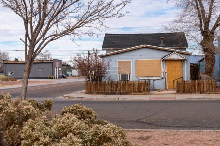 Photo for Winslow, Arizona - December 18, 2023: Sad, empty abandoned and boarded up home in Winslow Arizona - Royalty Free Image