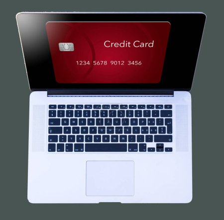 Foto de A generic red credit card is seen  from above on the screen of an open laptop computer in a 3-d illustration about online purchases and credit cards. - Imagen libre de derechos