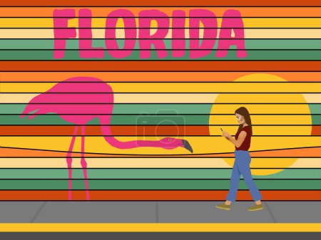 A girl on her phone walks by a very colorful promotional billboard for Florida tourism. A flamingo and sunset are included in the 3-d illustration.