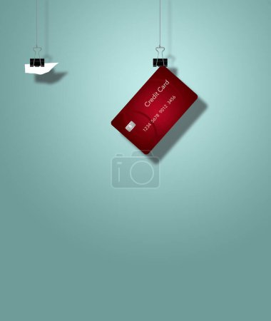 Photo for Back steel paper clamps hold a credit card and a scrap of paper in this 3-d illustration about credit cards. Copy space and text area available - Royalty Free Image