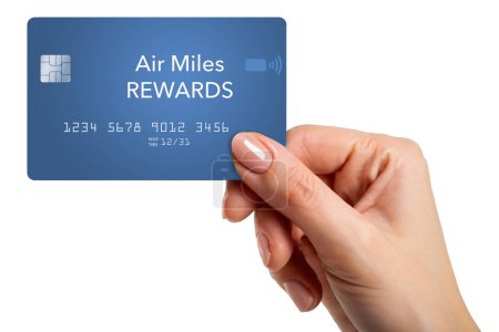 Here is a blue generic travel miles reward credit card being held in a girls hand in a  illustration isolated on the background.