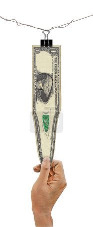 Una mano estira un dólar en esta ilustración tridimensional sobre cómo mantener el ritmo de la inflación en la economía. Esto se aísla en un fondo blanco con espacio de texto y área de copia.