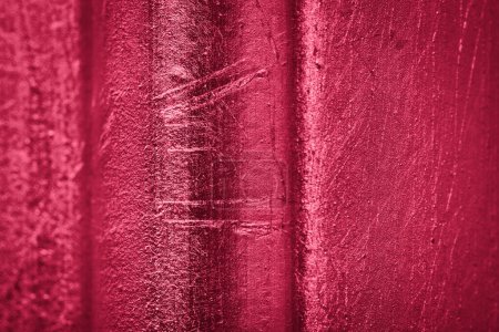 Photo for Relief wall in metallic viva magenta color. Red abstract background for color of the year 2023 - Royalty Free Image