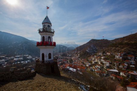 Photo for The Victory Tower (Zafer Kulesi) with the traditional houses in the background. Goynuk, Bolu, Turkey. - Royalty Free Image