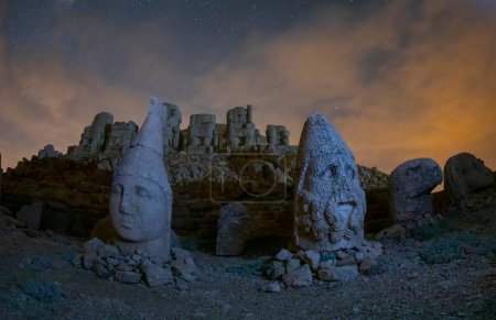 View of mount Nemrut and monumental sculptures of commagene kings and gods with colorful clouds and sky