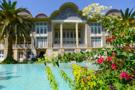 Photo for Persian garden of Eram with its beautiful pavilion, traditional Iranian fountain system and Palm trees in city of Shiraz, Iran. - Royalty Free Image