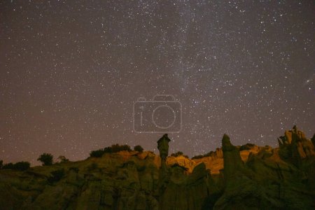 Photo for Night astronomical star and milky way photos in Kula fairy chimneys. Kula and its surroundings have a volcanic geological structure. - Royalty Free Image