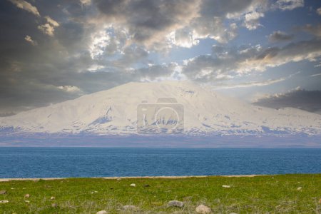 Photo for Carpanak Island is an island located in the northeastern part of Lake Van, in the Citren Village of the city of Van.A magnificent sunset, Touts (Ktuc) Monastery. Saint Jean Baptiste Church, distant - Royalty Free Image