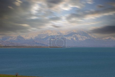Photo for Carpanak Island is an island located in the northeastern part of Lake Van, in the Citren Village of the city of Van.A magnificent sunset, Touts (Ktuc) Monastery. Saint Jean Baptiste Church, distant - Royalty Free Image