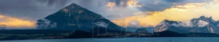 Photo for Aeiral panorama of Niesen mountain, also called as Swiss Pyramid with reflection on the Thun lake - Royalty Free Image