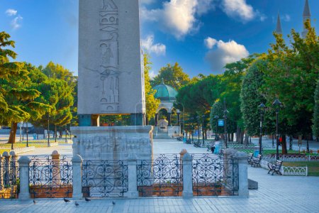 Photo for Obelisk of Theodosius on the former Roman Hippodrome, Istanbul, Turkey. Hippodrome of Constantinople city in summer. It is the Sultanahmet square in Istanbul today. Cityscape of Istanbul with - Royalty Free Image