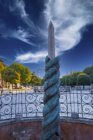 Photo for Obelisk of Theodosius on the former Roman Hippodrome, Istanbul, Turkey. Hippodrome of Constantinople city in summer. It is the Sultanahmet square in Istanbul today. Cityscape of Istanbul with - Royalty Free Image