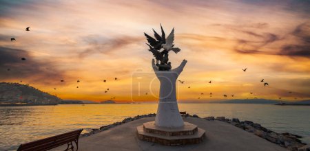 Hand of peace sculpture with doves on the waterfront in Kusadasi.