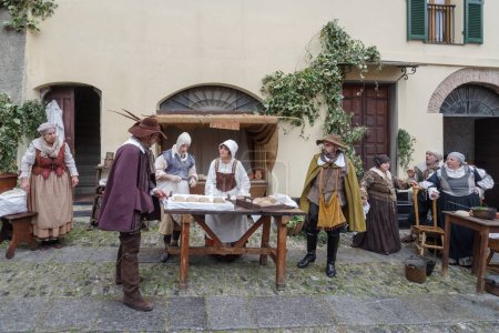 Photo for Taggia, Italy - February 26, 2023: Historical reenactment in the old town of Taggia, in Liguria region of Italy. The actors acting out episodes of daily life in settings that evoke moments of life lived fully the seventeenth century. The episodes dep - Royalty Free Image