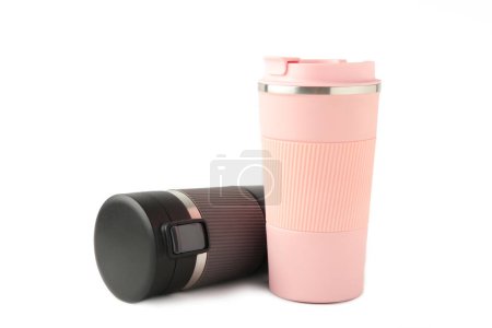 Photo for Two thermo cups or thermos mugs for tea or coffee isolated on white background. Black and pink for him and her. Hot beverage for couples. Top view - Royalty Free Image
