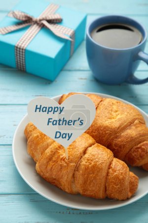 Photo for Father's day concept with gift, card and breakfast. Breakfast for dad with croissant and coffee. I love dad. Vertical photo - Royalty Free Image