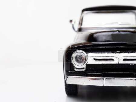 Téléchargez les photos : Half face view of a black truck miniature toys - en image libre de droit