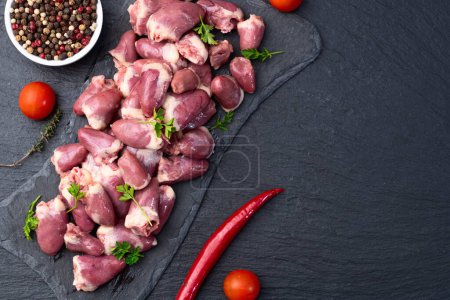 Raw chicken giblets hearts , meat background. Top view 