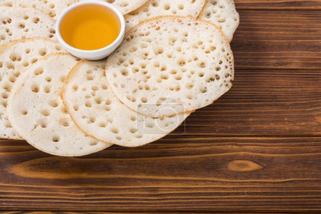 Baghrir - Moroccan traditional eating . Pancakes with honey 