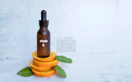 Vitamin C serum with orange fruit