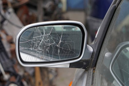 Photo for Cracked glass at car side mirror damage broken - Royalty Free Image