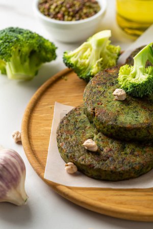 Photo for Vegan chick pea fritters on wooden plate healthy food - Royalty Free Image