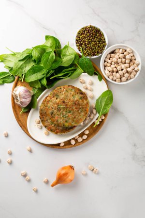 Photo for Vegan chick pea pancakes on wooden plate healthy food - Royalty Free Image