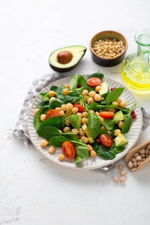 Photo for Close up of Vegan salad with chick-pea avocado spinach  healthy food concept - Royalty Free Image