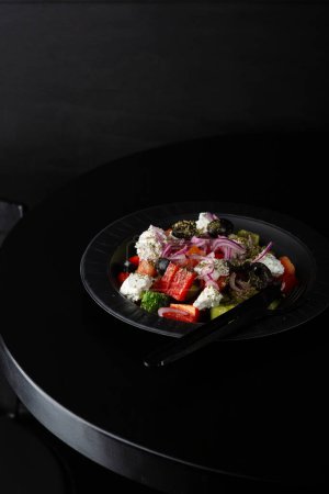 Foto de Close up of  Greek salad on black table food close up - Imagen libre de derechos