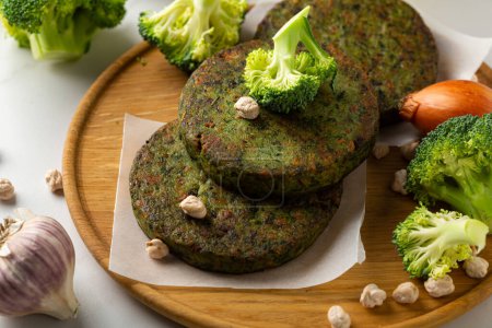 Photo for Broccoli and chick peas pancakes on plate vegan food - Royalty Free Image