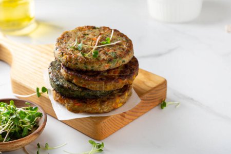 Photo for Vegan baked fritters stack healthy food and micro green - Royalty Free Image