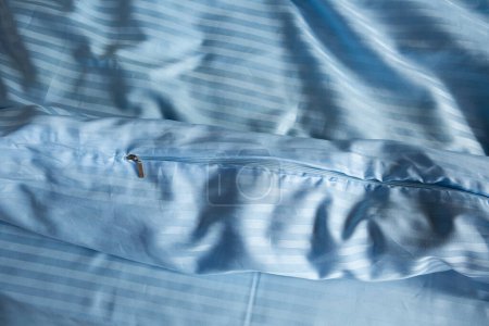 Photo for Close up of blue stripe satin bedding textile - Royalty Free Image