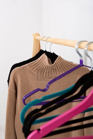 Photo for Beige sweater  and  hanger close up women's clothing - Royalty Free Image