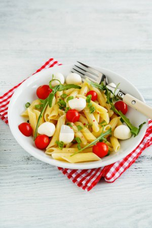 Photo for Delicious pasta with tomato and cheese, close-up food - Royalty Free Image