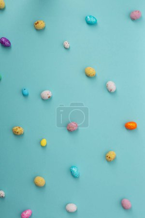 Photo for Easter cocnept colour eggs on blue surface - Royalty Free Image