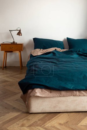 Photo for Two color washed cotton bed clothes in bedroom morning messy cozy home - Royalty Free Image