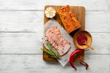 Photo for Piece and slices of smoked pork belly meat - Royalty Free Image