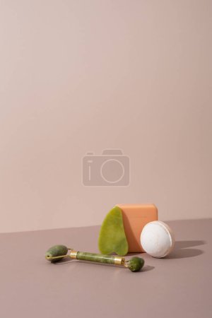 Photo for Facial massage roller gua sha scraper and soap - Royalty Free Image